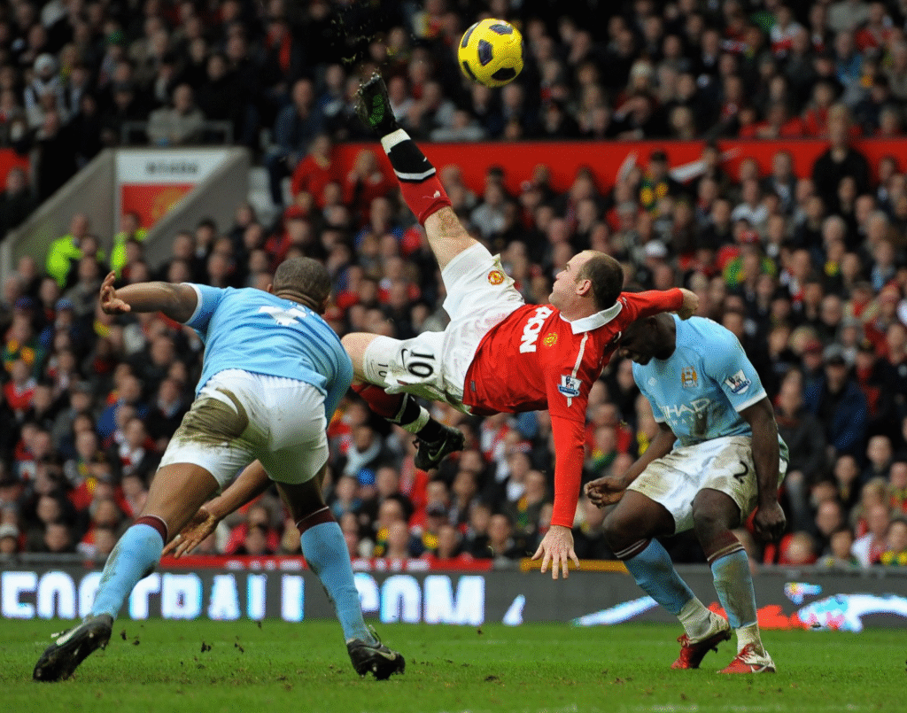 image-330-1024x805 Wayne Rooney impressionne les stars de la télévision avec un retourné acrobatique magistral, la légende de Man Utd recréant un but célèbre du derby.